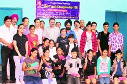 Winners of the Open Punjab Ranking Table Tennis Tournament pose for a photograph in Ludhiana on Sunday