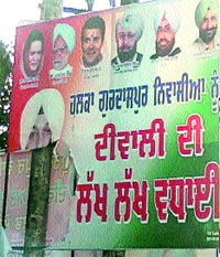 A damaged poster of Major Amardeep Singh Manepur in Gurdaspur district