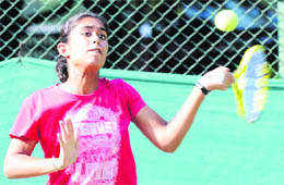 A girl plays a shot during a tennis match in Chandigarh on Monday. 