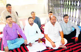Kanungos stage a protest after locking the tehsil gate in Haridwar on Monday. 