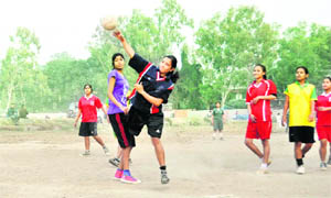 Players in action in a match in the District-level Handball Tournament in Dehradun on Monday.