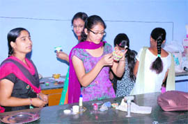 Students participate in diya decoration competition at the Festival Celebration Competitions held at Indira Gandhi National College, Ladwa (Dhanora). 