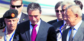 Libyan interim Defence Minister Mohammed Dfeynas (R) welcomes NATO chief Anders Fogh Rasmussen in Tripoli on Monday.