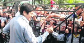 Kiran Bedi shakes hands with students of St Josephs Academy during her visit to Dehradun on Tuesday.