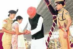 Union Minister of State for Home Jitendra Singh presents the Presidents Police Medal for gallantry to the widow of a CRPF martyr at the forces 72nd anniversary at Kadarpur in Gurgaon