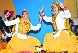 Girls perform Haryanavi dance at the 46th Haryana Day function at Raj Bhavan in Chandigarh 