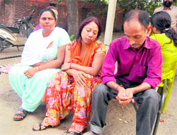 Grieving family members of Rajan Uppal, a jail inmate, who died in the Civil Hospital in Amritsar on Wednesday
