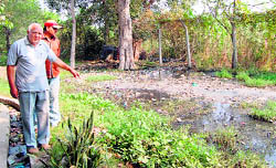 Residents of Rajiv Nagar show the pollution caused due to Ganda Nullah near Lohgarh in Amritsar