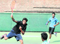 Anwar Shahul of Karnataka plays a shot during a doubles match of the CLTA-AITA Mens Tournament in Chandigarh