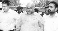 Kamaljit Singh Walia, owner of Commando Caterers, being produced in a court in Mohali 