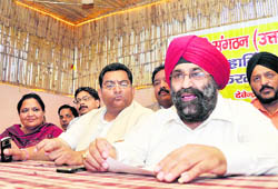 State president of the Punjabi Sangathan Devender Sethi addresses a press conference in Dehradun on Tuesday. 