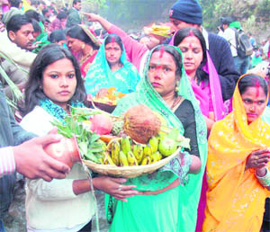 Devotees participate in Chhath Puja at Tapkeshwar in Dehradun on Tuesday. 