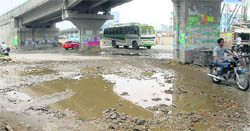 A damaged road beneath the railway overbridge near Khalsa College in Jalandhar.