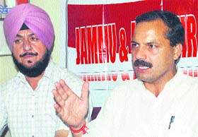 Panthers Party leader Balwant Singh Mankotia (right) addresses a press conference in Jammu on Wednesday