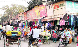 Wooden shops in Chaura Bazaar, which caught fire on Monday night