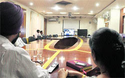MC officials take part in a video conference in Ludhiana on Wednesday