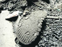 A shoe lying in debris at the furnace unit in Ludhiana on Wednesday