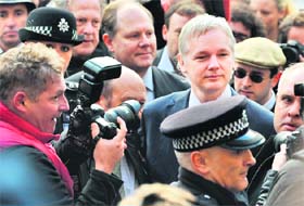 WikiLeaks founder Julian Assange arrives for the hearing at London High Court