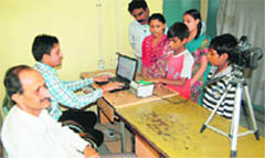 The family of an ESI beneficiary gets smart cards made in Amritsar. 
