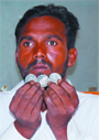 Charanjit Singh showing the coins of the Victorian era unearthed in Mehma Sawai. 