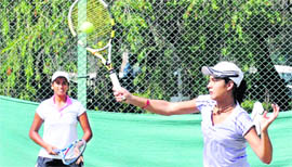 Riya Bhatia and Victoria Chahal in action during their doubles match at the CLTA Sports Complex in Chandigarh on Thursday.