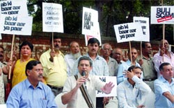 Members of various RWAs protest against the proposed hike in power tariff in New Delhi on Thursday