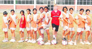 Girl footballers of Unison School with a foreign coach at a camp in Dehradun on Thursday. 