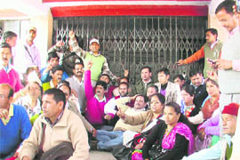 Gram Pradhans hold a dharna in Pithoragarh on Thursday. 