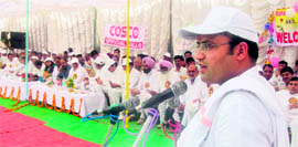 Sirsa MP Ashok Tanwar addresses the gathering after inaugurating the CBSE Football Tournament in Fatehabad.