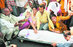 Relatives and family members of a youth, who allegedly died in police custody, protest outside the GMCH in Jammu