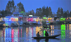 Tourists enjoy shikara rides on the Dal Lake in Srinagar 