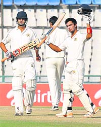 Punjabs Mandeep Singh raises his bat after completing his century against Uttar Pradesh during their Ranji Trophy match at PCA stadium, Mohali, on Thursday