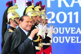 Italy's Prime Minister Silvio Berlusconi arrives at a Euro Zone meeting before a G20 summit of major world economies in Cannes on Thursday