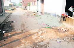 A road in a dilapidated condition in Sada Shiv Enclave