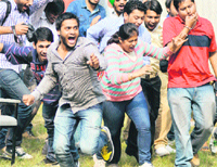Students of Punjabi University, Patiala, in a jubilant mood after winning the overall trophy of Soch-11 at Panjab University on Friday.