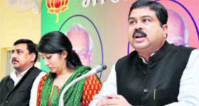 Dharmendra Pradhan (right), BJP general secretary (national), addresses a press conference in Dehradun on Friday. 