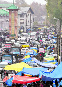 Shoppers throng a market ahead of the Eid-ul-Azha in Srinagar on Friday.