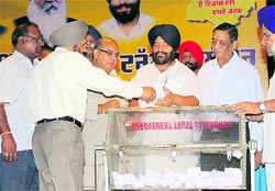 Chairman of the Jalandhar Improvement Trust Baljit Singh Neelamahal presides over the draw ceremony for plots in Surya Enclave Extension in Jalandhar on Friday