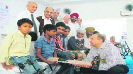 Members of the Bharat Vikas Parishad, Rotary Club and senior citizens donat artificial limbs to the needy at Rotary Bhawan in Ludhiana.