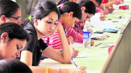 Students take part in a creative writing contest at Ramgarhia Girls College in Ludhiana on Saturday.