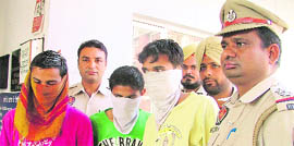 The stage-managed snatching accused in police custody.