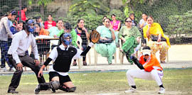 A match in progress during the seventh Senior District Baseball Championship at Khalsa College for Women in Ludhiana on Saturday.