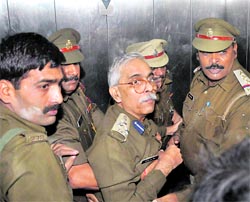 DIG Fire Services DD Mishra (centre) being taken for a medical check-up in Lucknow