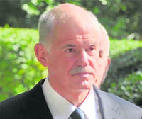 Greek PM George Papandreou leaves the Presidental Palace in Athens on Saturday.