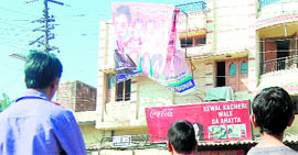 A view of the hoarding in front of the house from the terrace of which the youth fell to meet his end at Dhapai Chowk in Amritsar on Sunday.