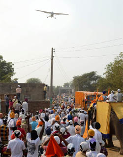Flower petals being showered on the procession from an aircraft near Dhulkot village during Nagar Kirtan on Sunday. 