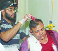 Amit Chopra gets treatment at the Civil Hospital in Jalandhar on Sunday. 