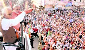 Senior BJP leader LK Advani and Gujarat Chief Minister Narender Modi at a public meeting during his Jan Chetna Yatra at Dilimora in Gujarat on Sunday