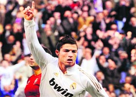 Real Madrid's Cristiano Ronaldo celebrates after scoring against Osasuna during the Spanish League in Madrid on Sunday