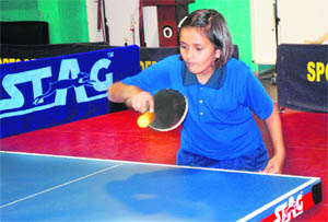 A player returns a shot during the Gurukul Global 24th Chandigarh State TT Championship in Table Tennis Hall at Sector 23 in Chandigarh on Monday. 